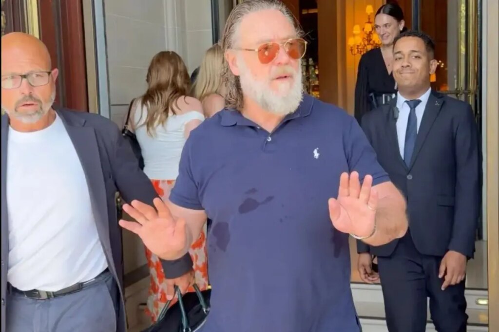 Russell Crowe warns autograph hunters gathered outside his Paris hotel: ‘Don’t f–king push in on me’