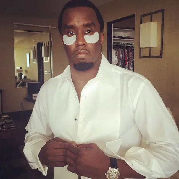 Diddy wearing eye patches and a white shirt.