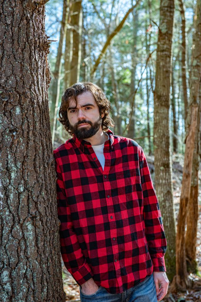 Nick in front of a tree