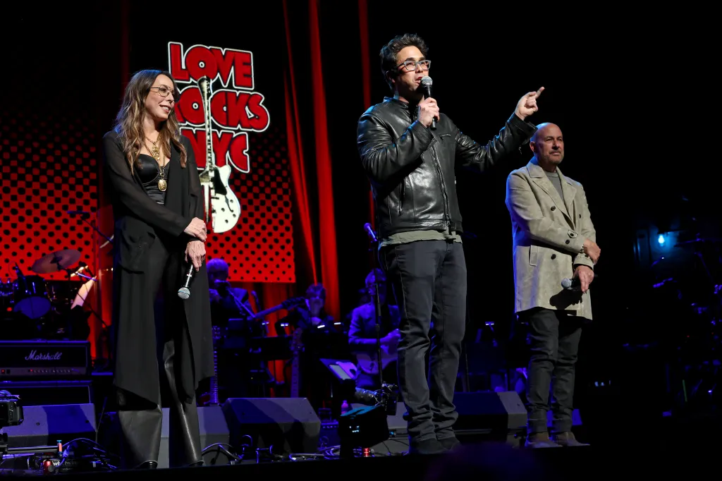 Greg Williamson (center) at March's Love Rocks presentation.