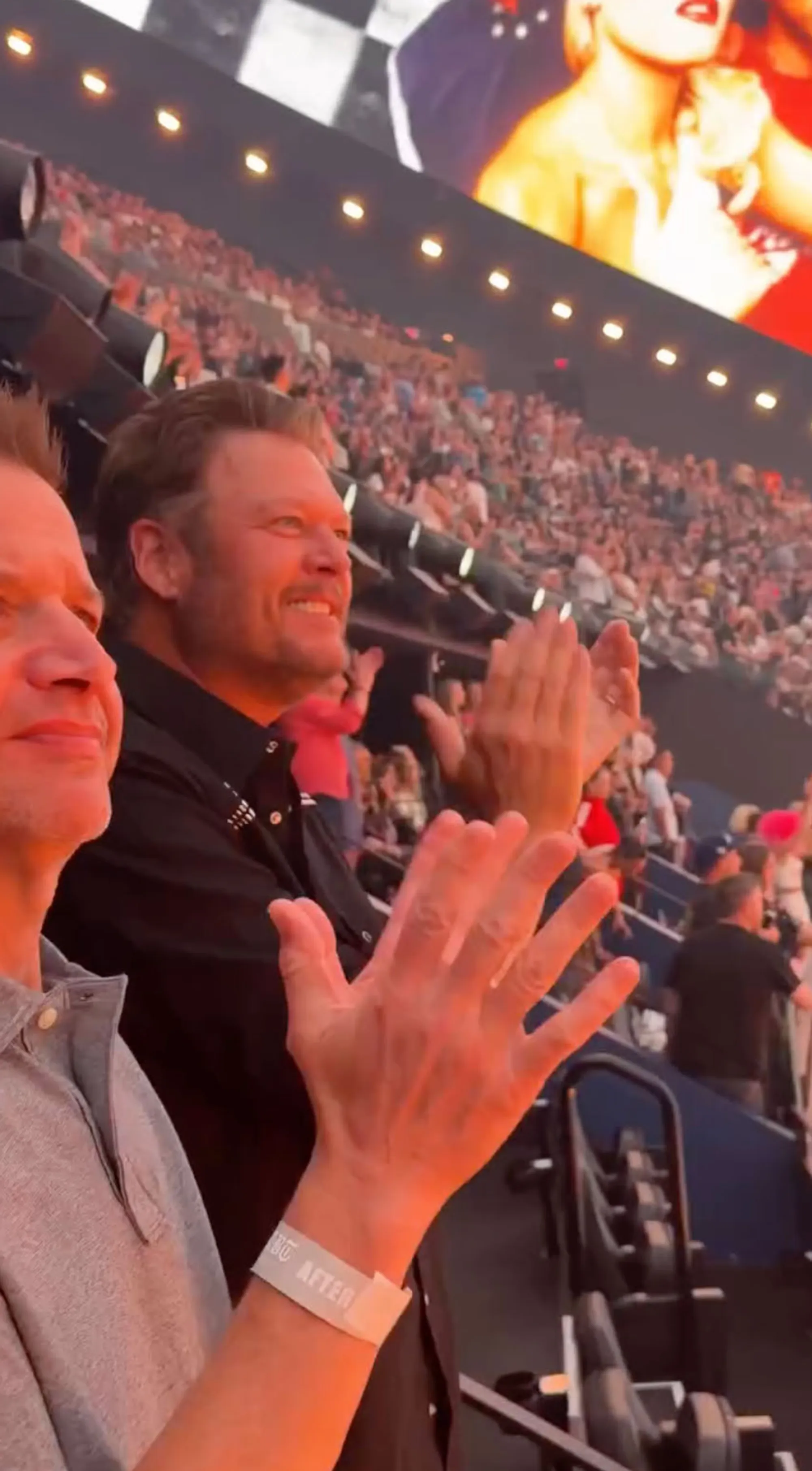 Blake Shelton watching Gwen Stefani perform.
