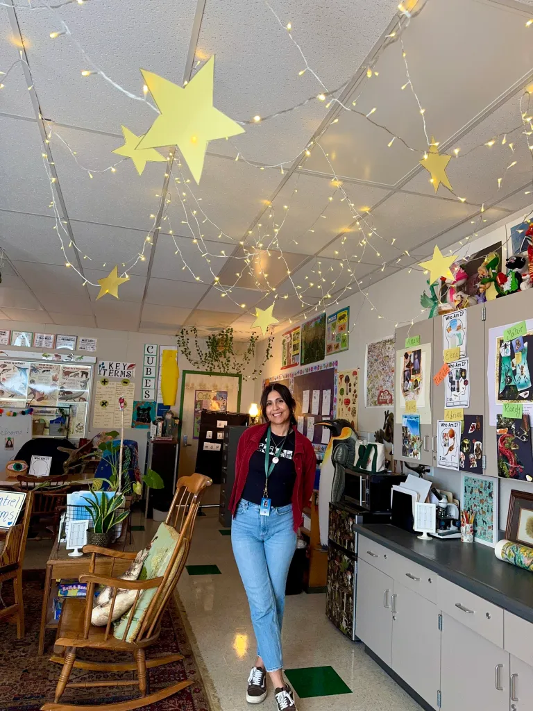 Shaina Montiel, a hantavirus survivor, stands in what appears to be a classroom.