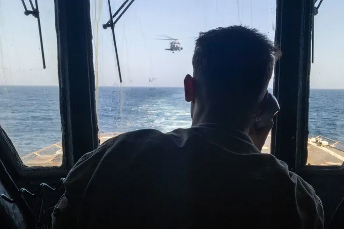 A US sailot stands watch aboard the USS Michael Murphy in the Arabian Sea.