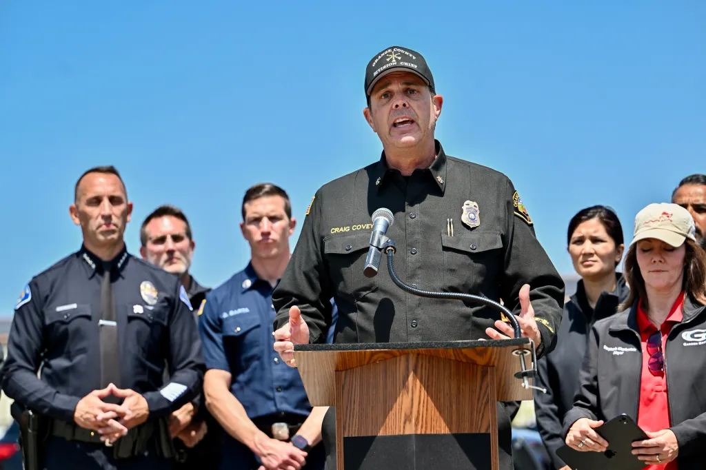 Orange County Fire Authority Division Chief Craig Covey speaks at a news conference about a hazmat situation.