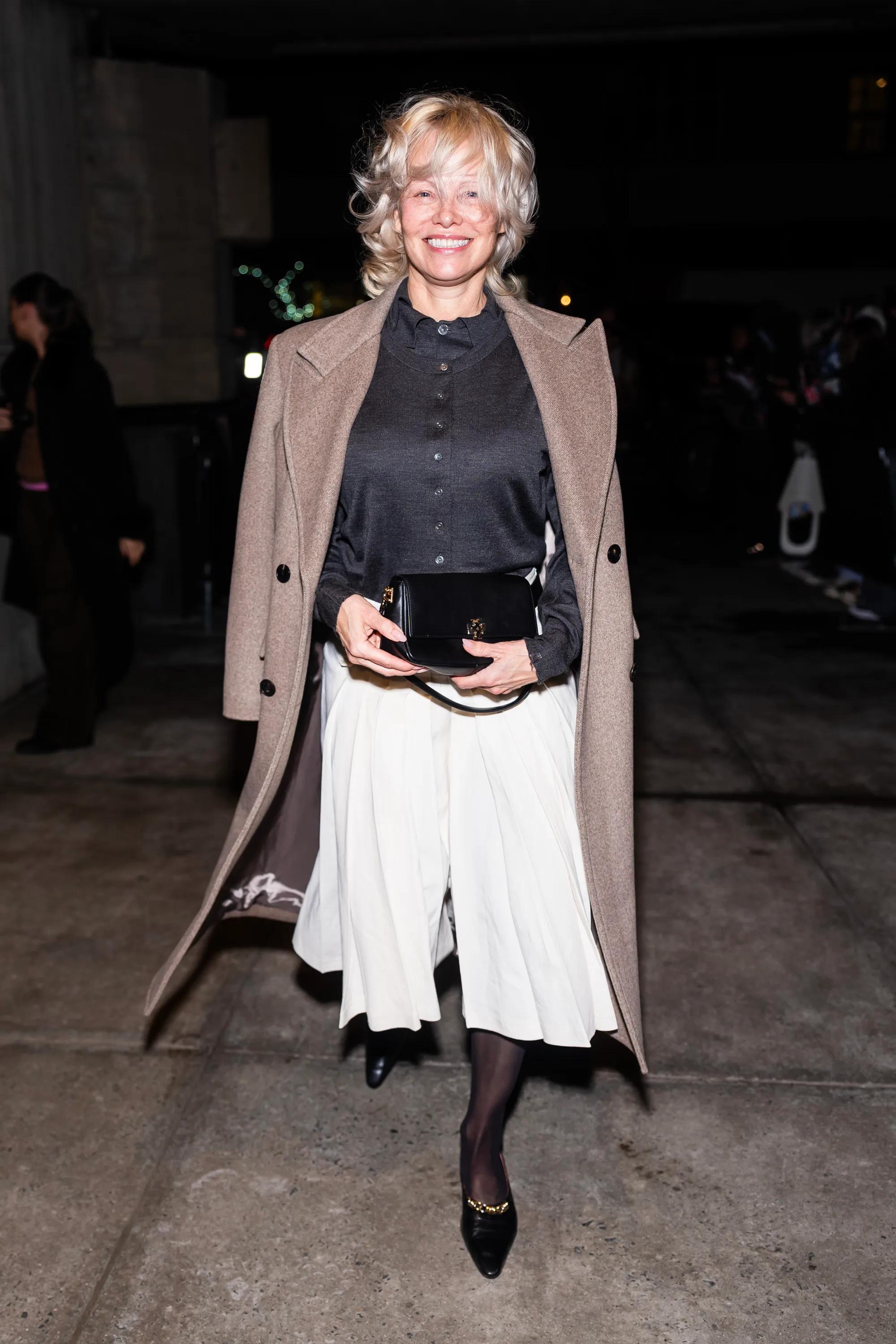 Pamela Anderson attends the Tory Burch Fashion Show during New York Fashion Week.