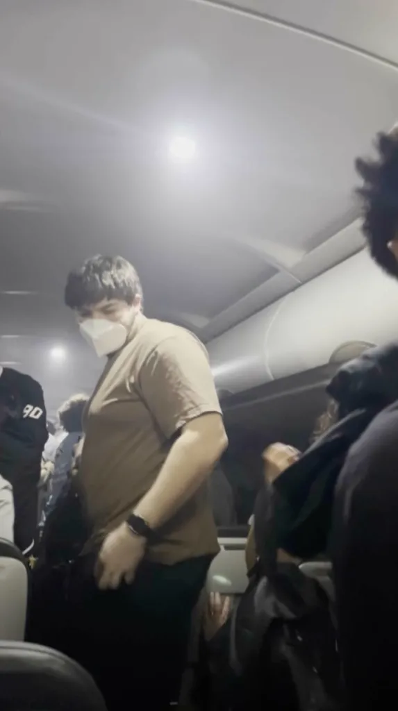 Passengers disembarking a Frontier Airlines plane.