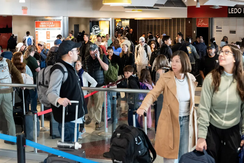 Passengers wait in a long TSA security checkpoint queue at Baltimore/Washington International Thurgood Marshall Airport.