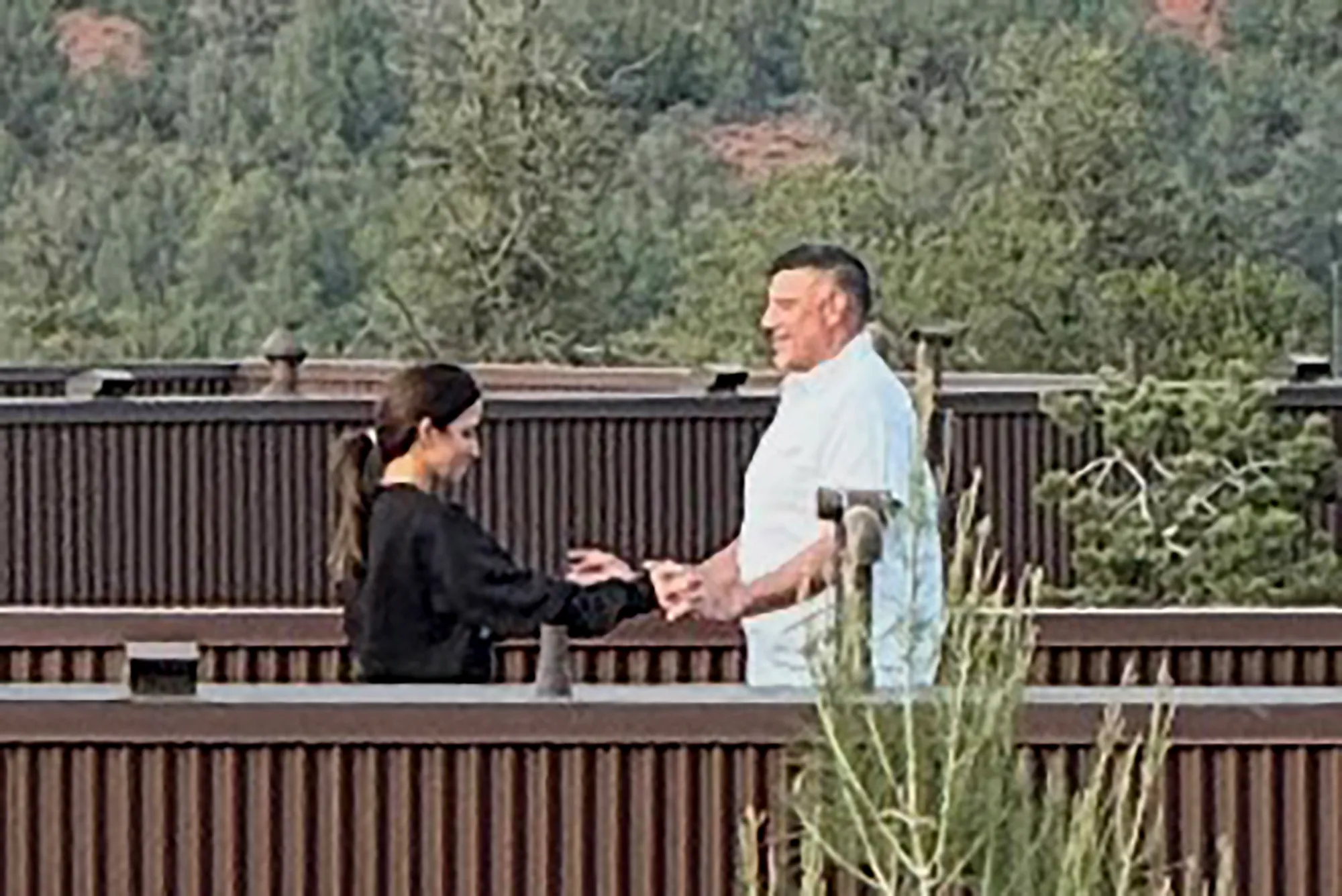 Mike Vrabel and Dianna Russini holding hands at Ambiente Sedona hotel.