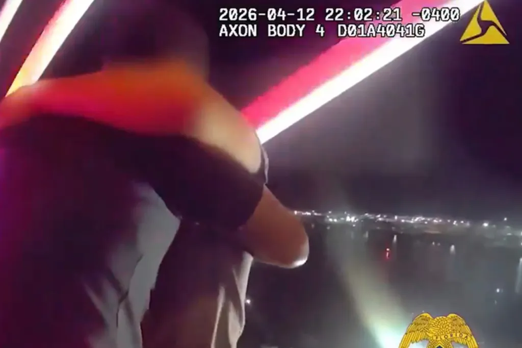 Bodycam footage showing a man standing on the edge of a bridge at night, with city lights visible in the distance.