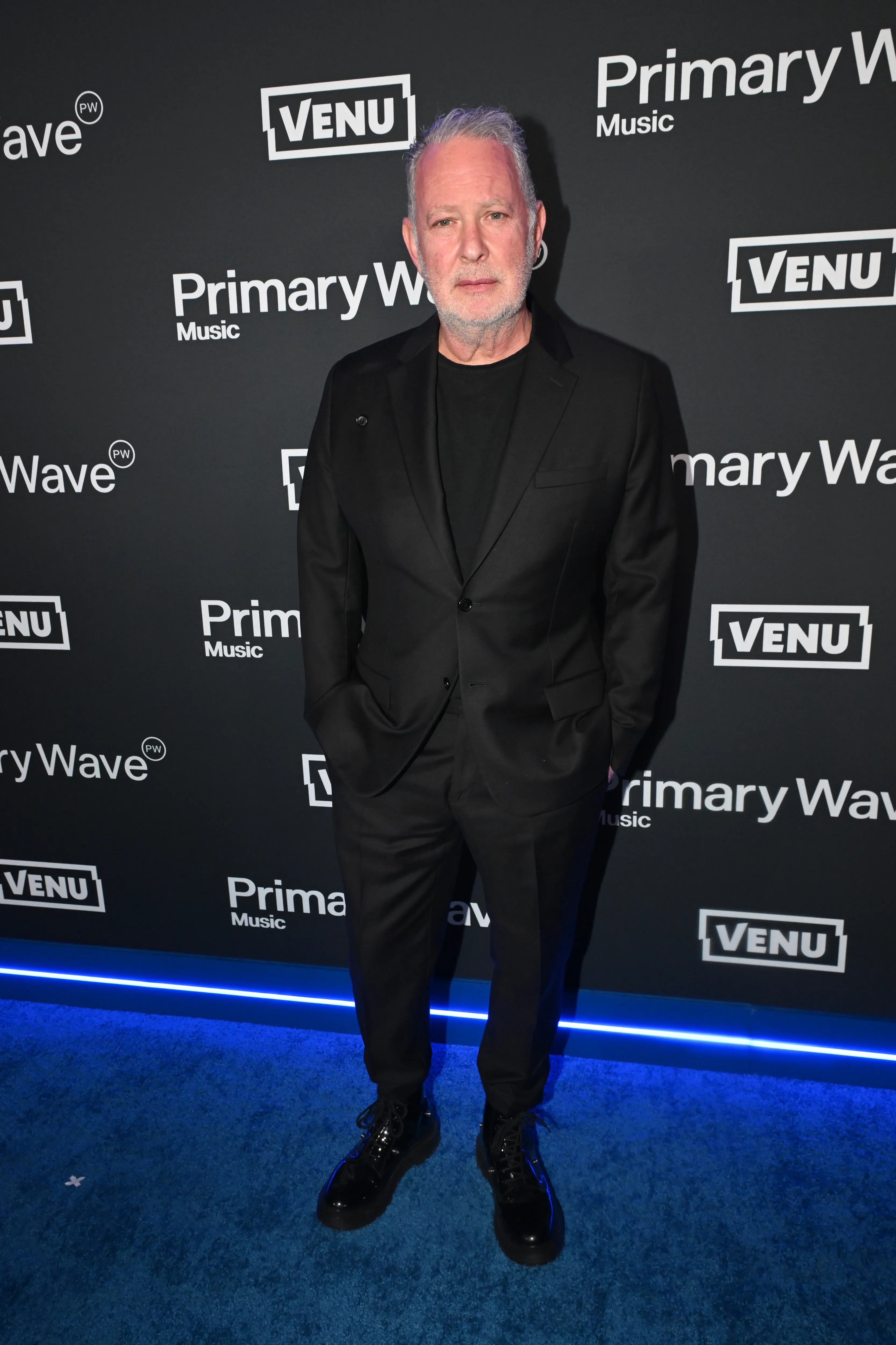 Paul Kemsley poses on the blue carpet at Primary Wave's Annual Pre-Grammy Party.