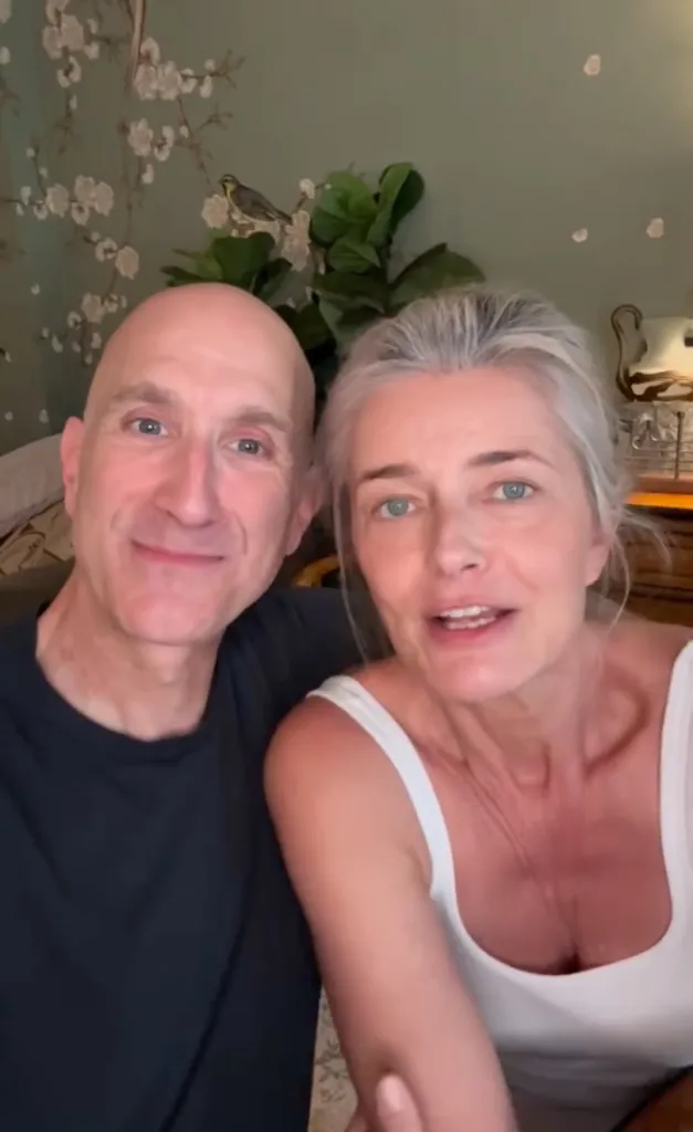 Paulina Porizkova and Jeff Greenstein smiling at the camera.