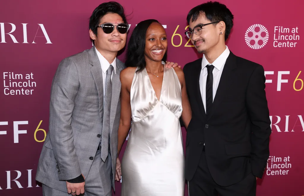 Pax Thien Jolie-Pitt, in a grey suit, grey tie and white shirt and sunglasses, Zahara Marley Jolie , in a white satin dress, and Maddox Chivan Jolie, in a black suit and black tie and white shirt, attend the 'Maria' screening.