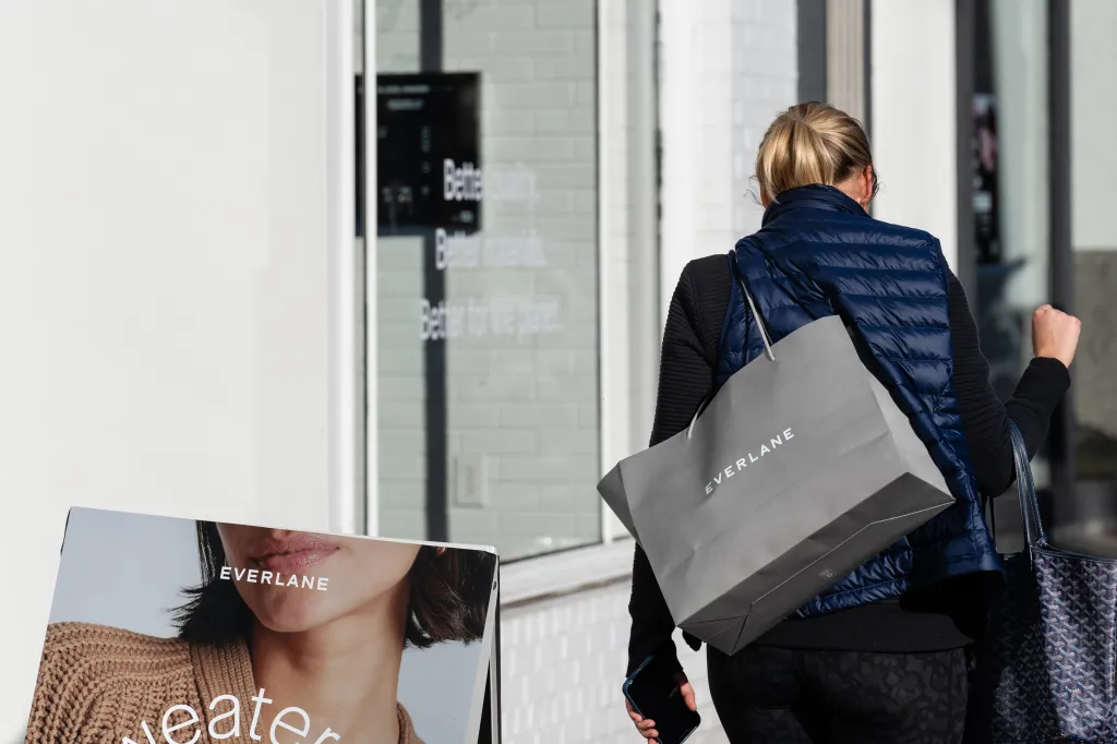 A pedestrian carries an Everlane shopping bag in Washington, D.C.