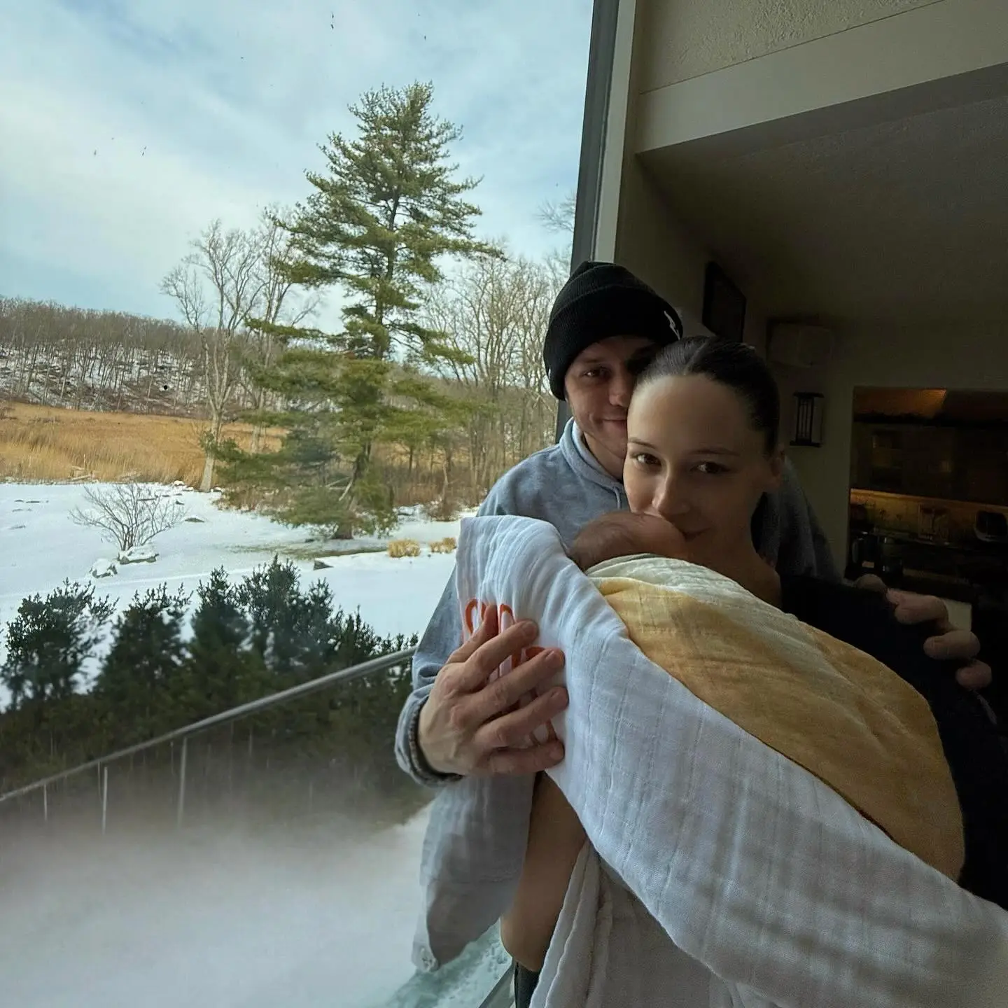 Pete Davidson and Elsie holding their baby.