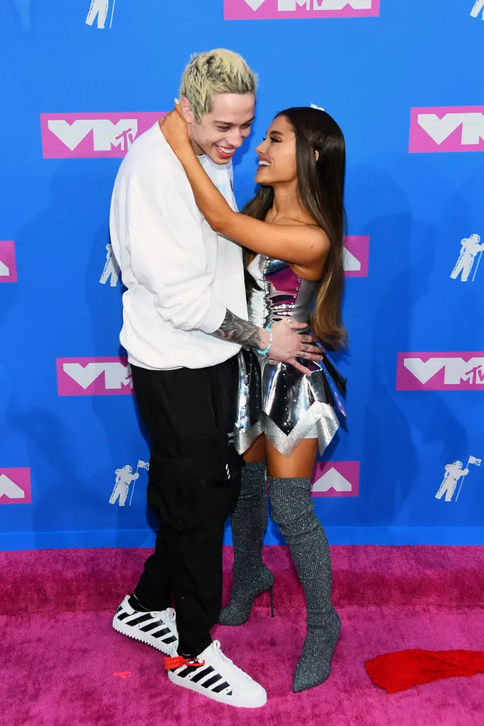 Pete Davidson and Ariana Grande embrace on the red carpet at the 2018 MTV Video Music Awards.