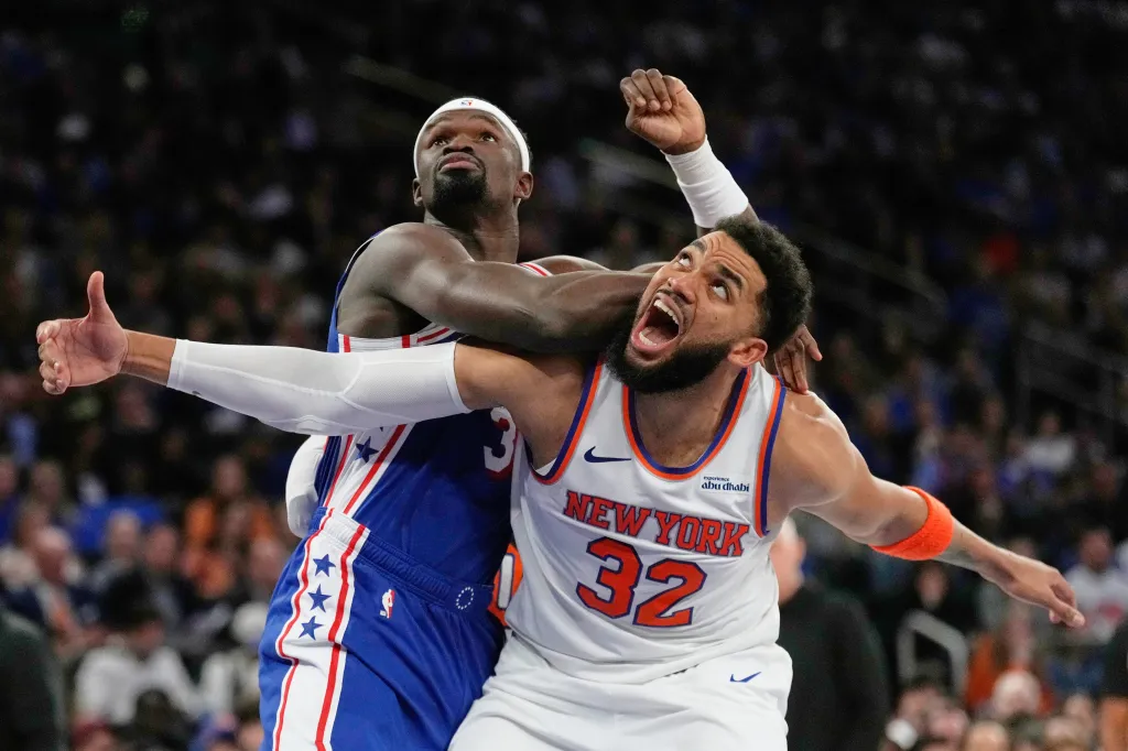 Adem Bona fouling Karl-Anthony Towns during an NBA game.