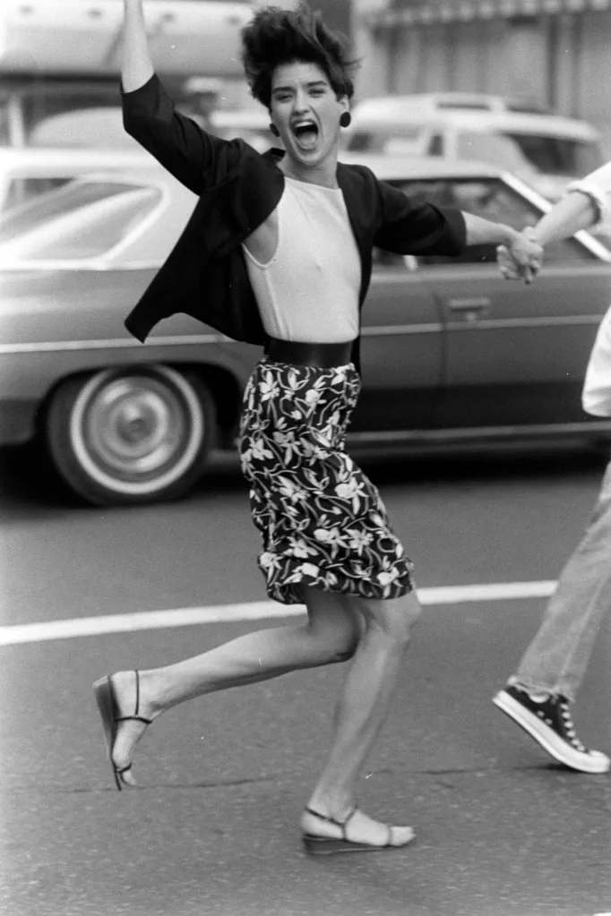 Janice Dickinson in a floral skirt and black blazer for Michael Kors's Spring 1983 Sportswear Collection.