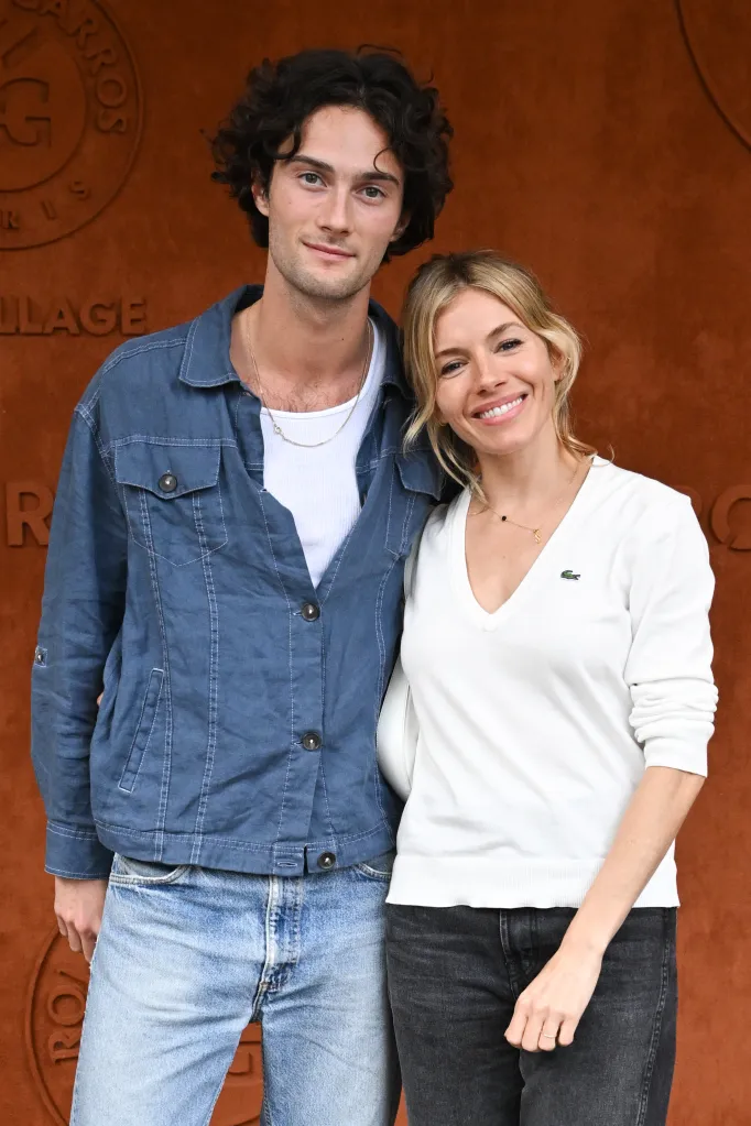 Oli Green and Sienna Miller pose at the French Open.