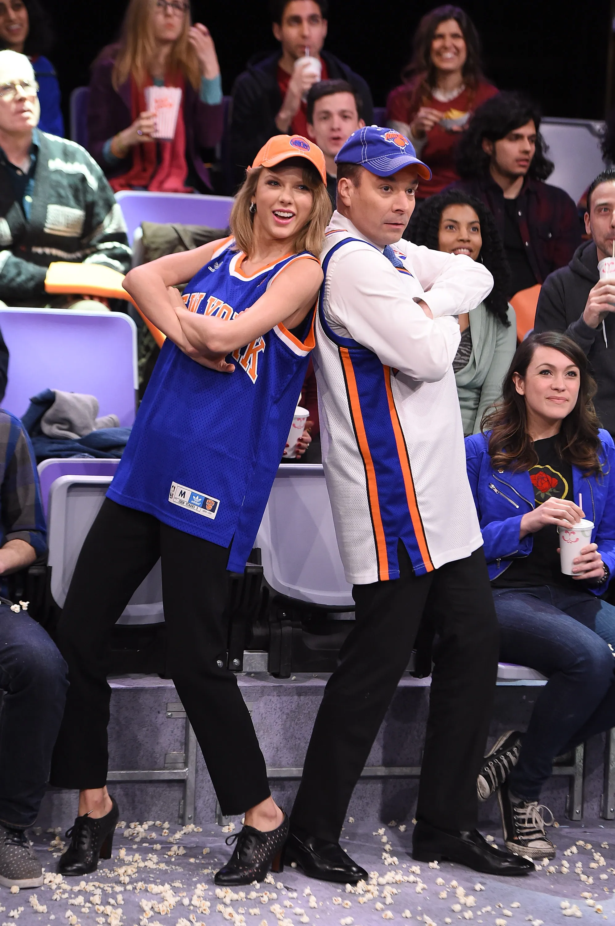 Taylor Swift and Jimmy Fallon dressed in New York Knicks jerseys.