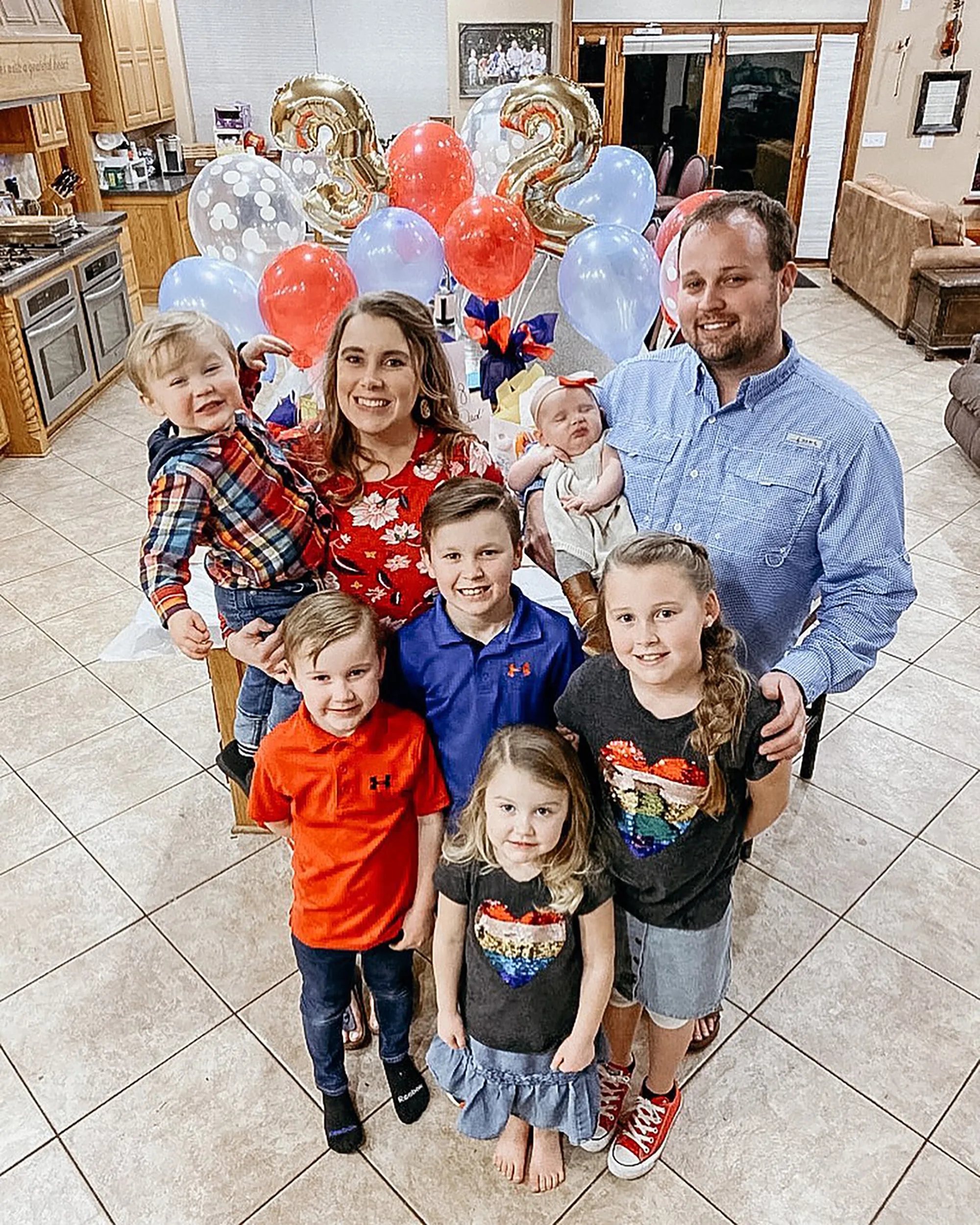 Anna and Josh Duggar with their seven children, celebrating their son Mason's 3rd birthday and daughter Maryella's 2nd birthday.