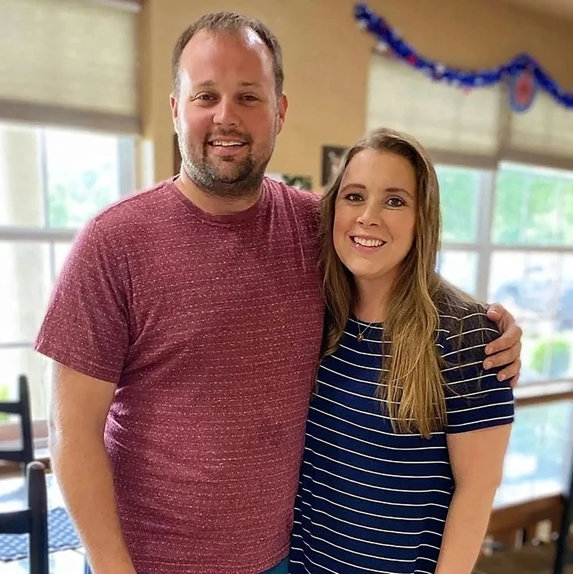 Josh and Anna Duggar smiling.