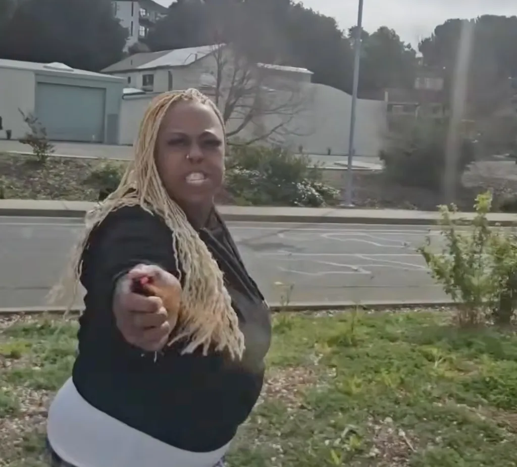 Tiffany Bagby, 41, pointing pepper spray at the camera.