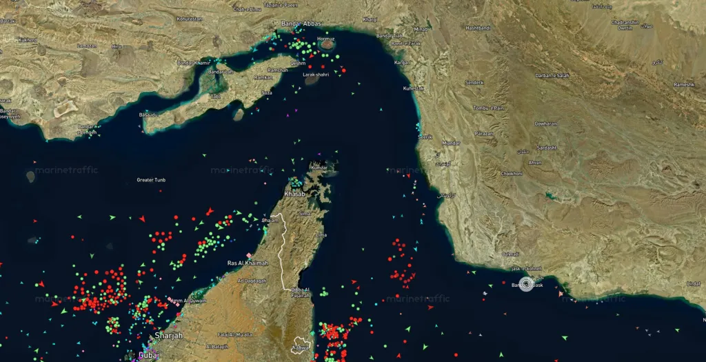 Satellite image of the Strait of Hormuz showing vessel traffic, with the Port of Jask circled.