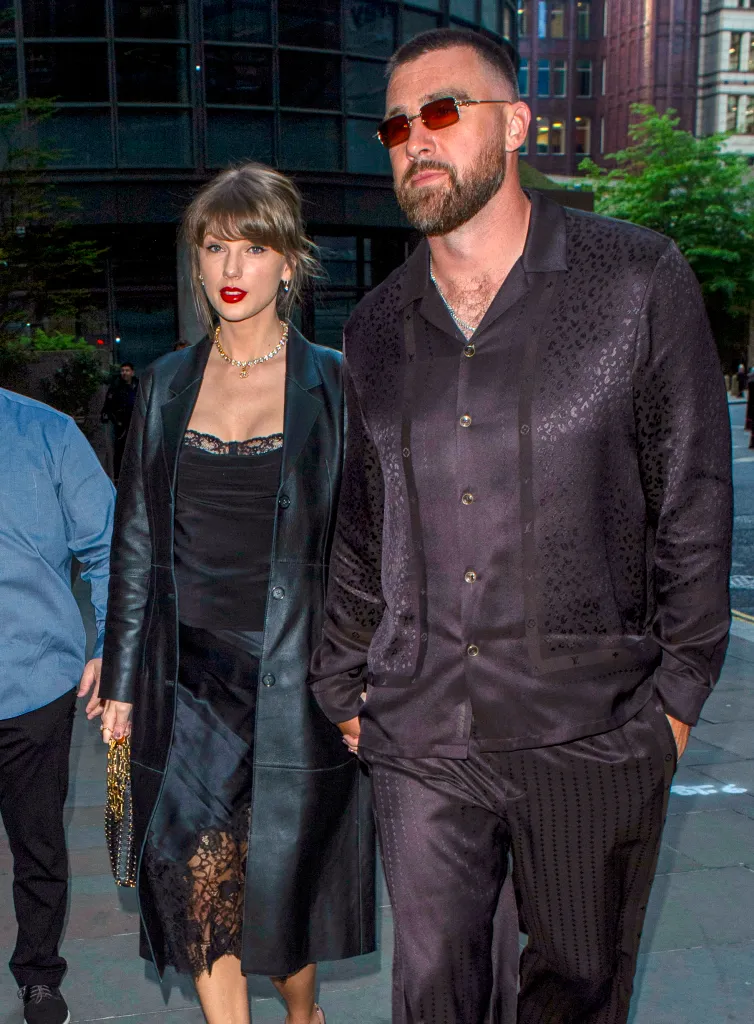 Taylor Swift and Travis Kelce walking outside.