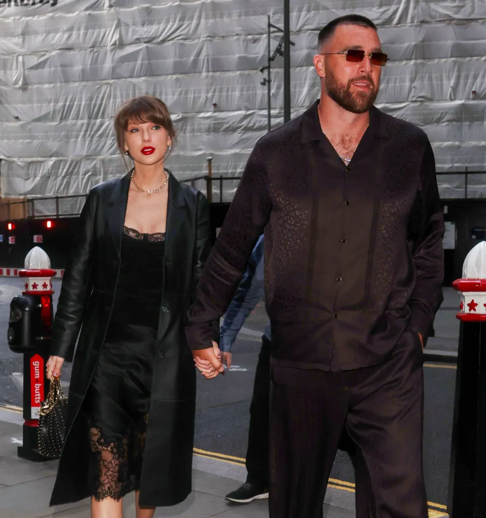 Taylor Swift and Travis Kelce holding hands while leaving a restaurant.