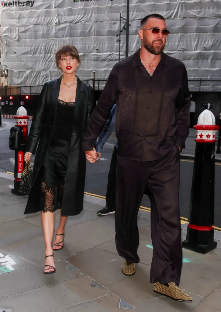 Taylor Swift and Travis Kelce walking hand-in-hand in London.