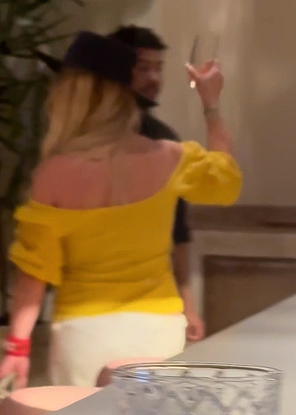 Britney Spears in a yellow top at Red O Mexican Restaurant.