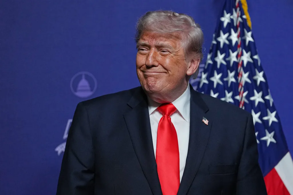 Donald Trump smiling at an event.