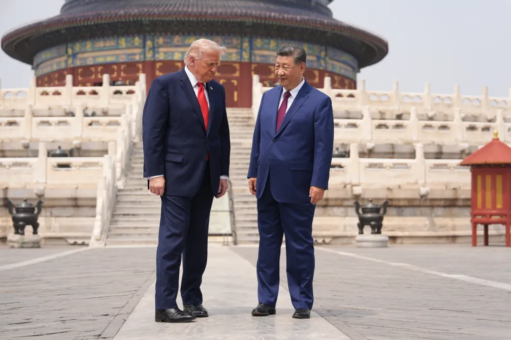 President Donald Trump and Chinese President Xi Jinping stand together at the Temple of Heaven in Beijing.