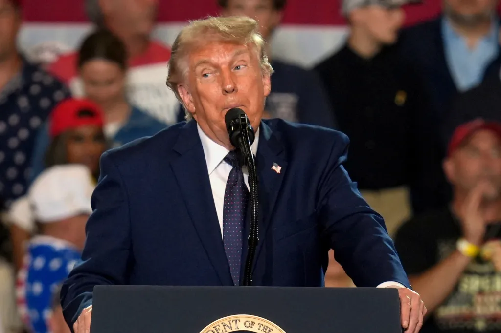 Donald Trump speaking at a podium during a 