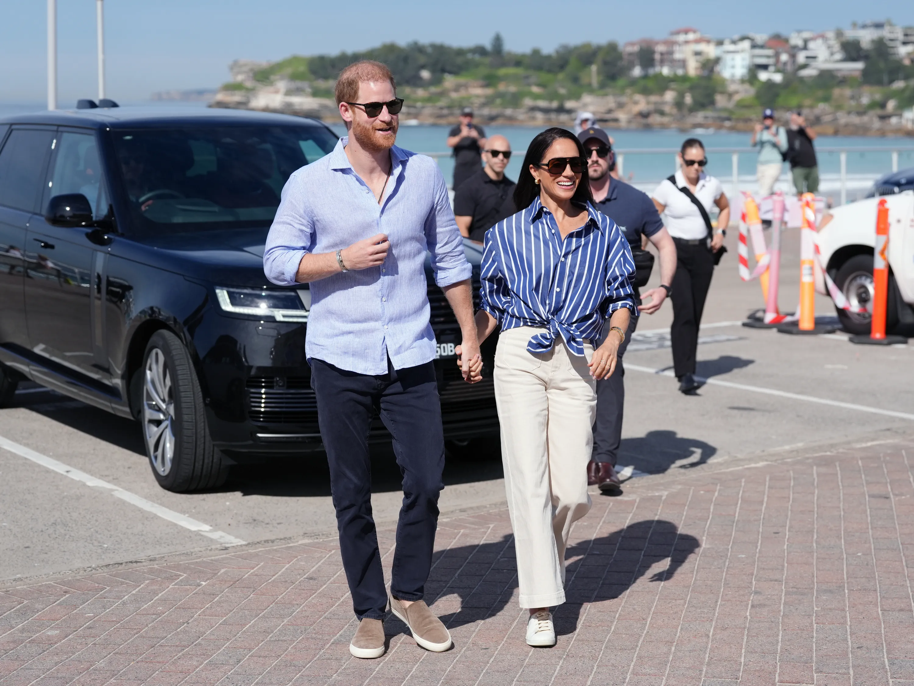Prince Harry and Meghan, Duchess of Sussex, arriving at Bondi Beach.