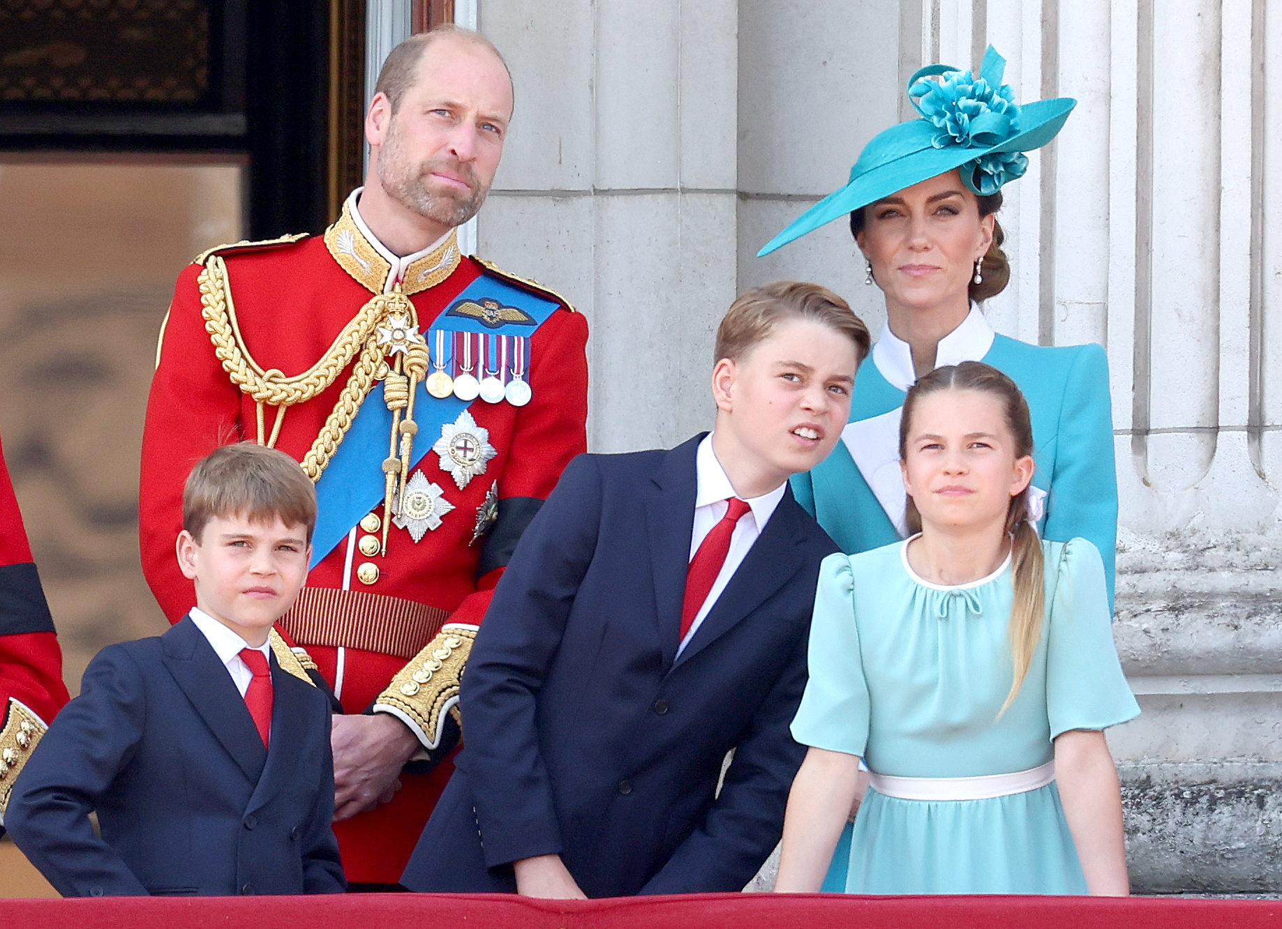 Prince William, Prince of Wales, Prince George of Wales, Princess Charlotte of Wales, and Catherine, Princess of Wales, on the balcony of Buckingham Palace.