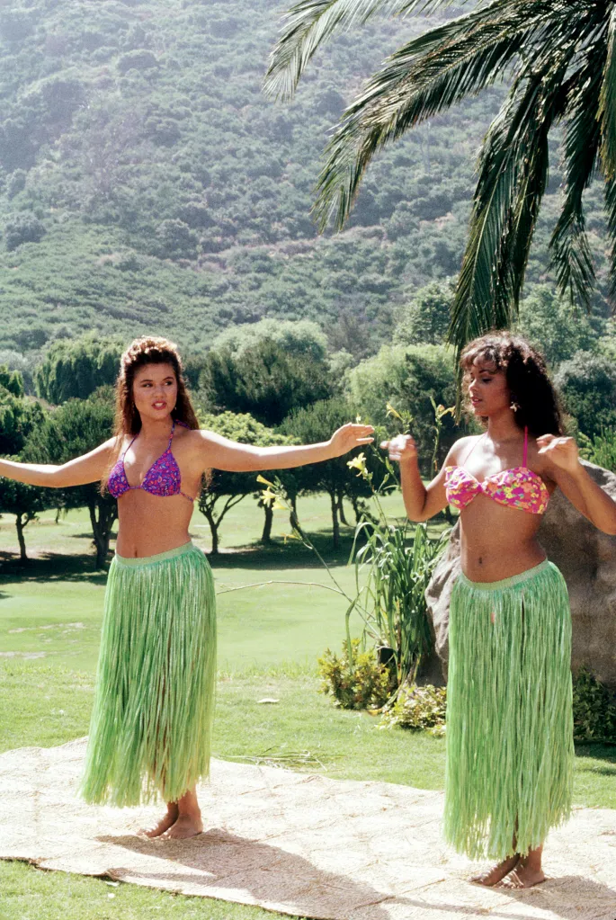 Lark Voorhies and a costar dancing the Hula in 