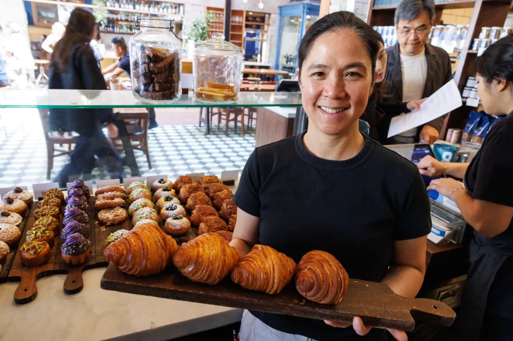 République chef and owner Margarita Manzke holds a board of fresh croissants.