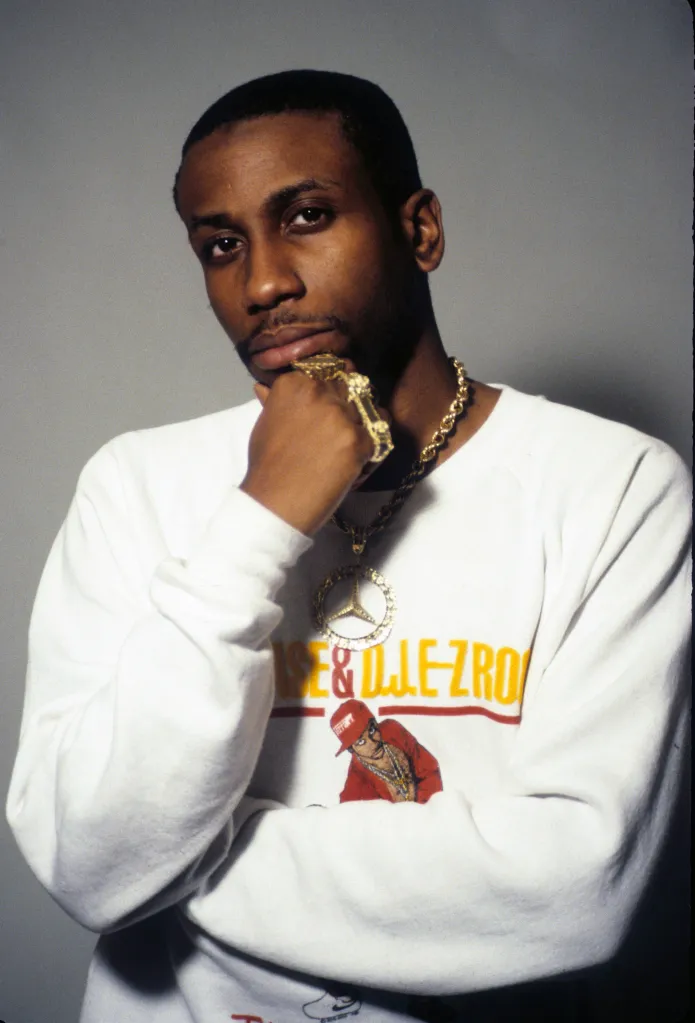 Rapper Rob Base (aka Robert Ginyard) poses for a portrait, wearing a sweatshirt with his own likeness.