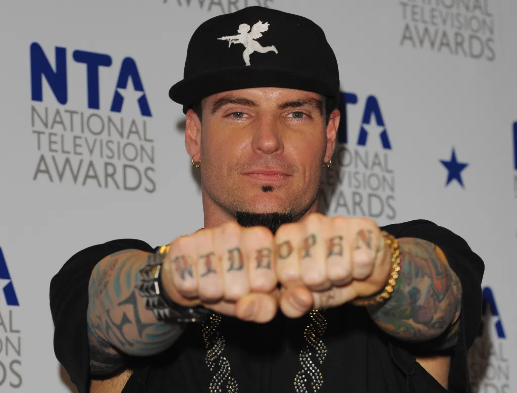 Rapper Vanilla Ice posing backstage at the National Television Awards.