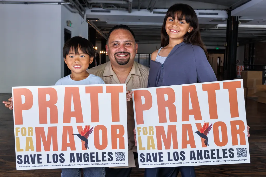 Raul Claros, Aadyn, and Valentina holding 
