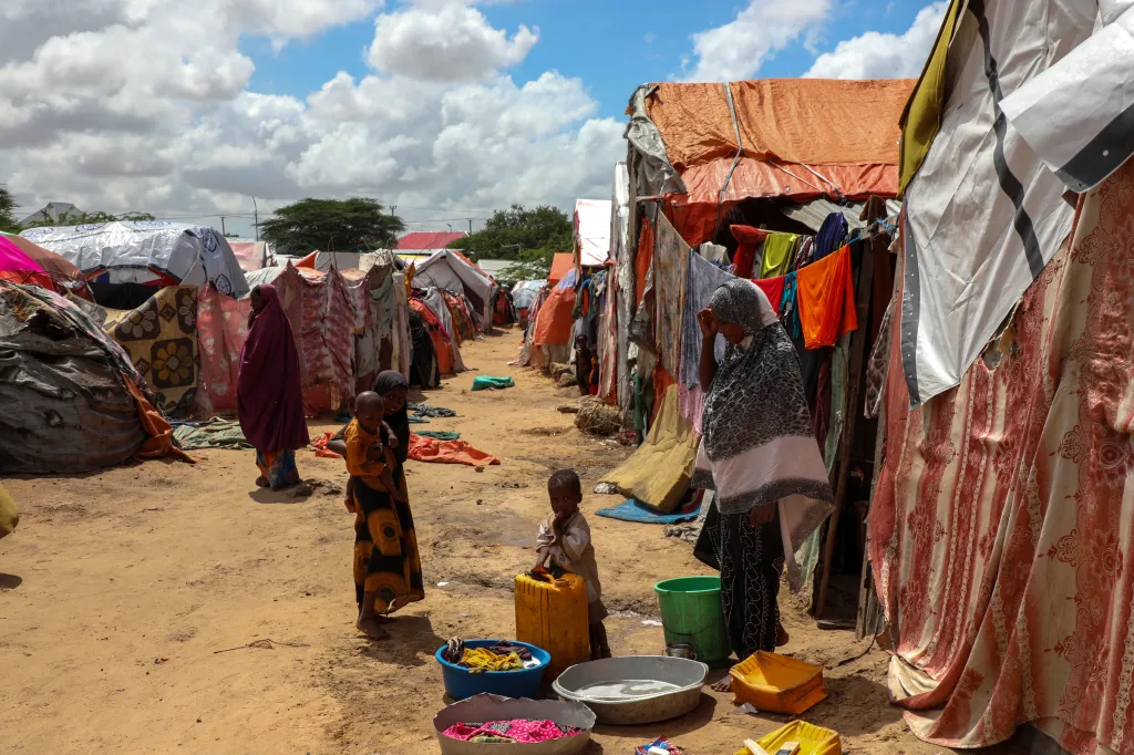 Women and children in makeshift tents at Maacani Camp, Mogadishu, Somalia.