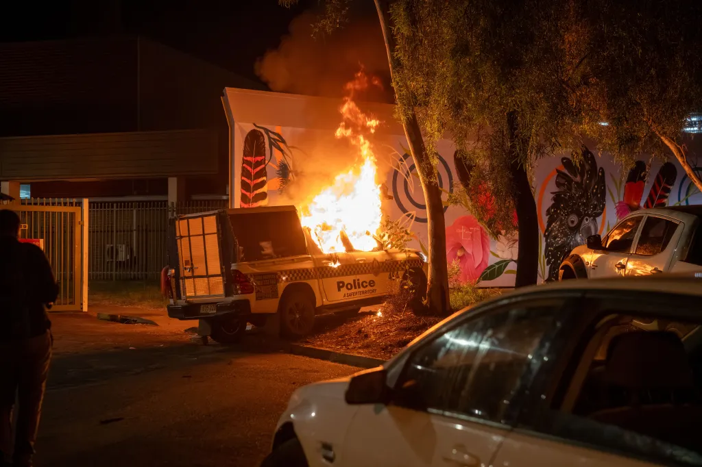 Flames engulf a police car during a riot in Alice Springs, Australia, on April 30, 2026.