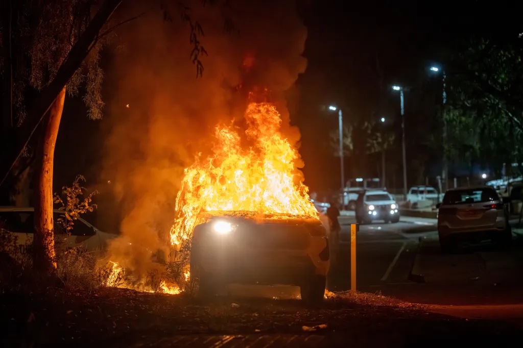A police vehicle burns during a clash with Indigenous community members on April 30, 2026.