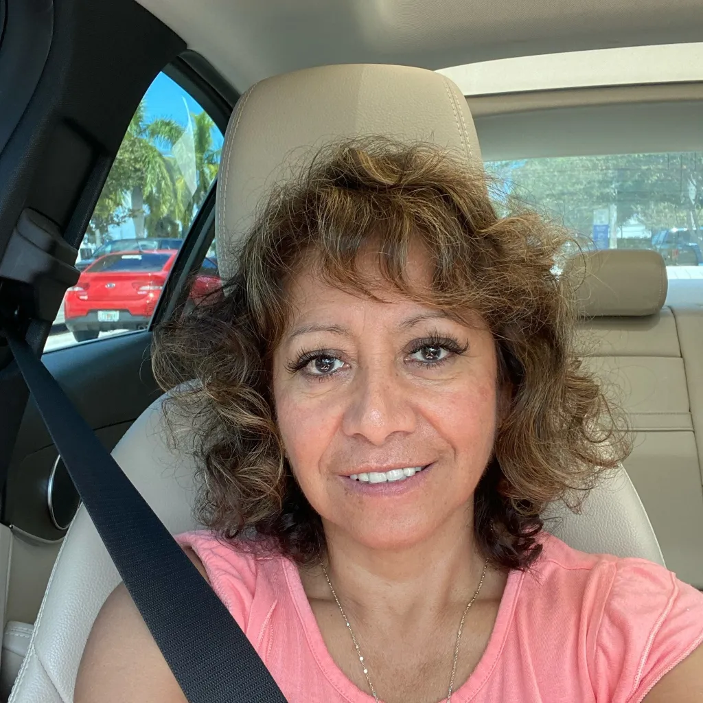 Rita Loncharich, a 65-year-old woman, in a car wearing a seatbelt.