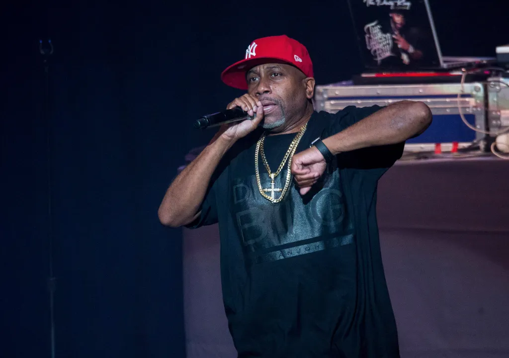 Rapper Rob Base performs on stage at a concert.