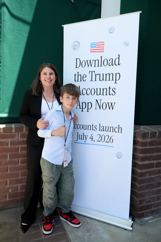 Robin D. Shapiro and her son Marty stand next to a 
