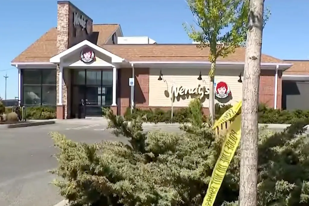 Wendy's restaurant with yellow police tape across the front.