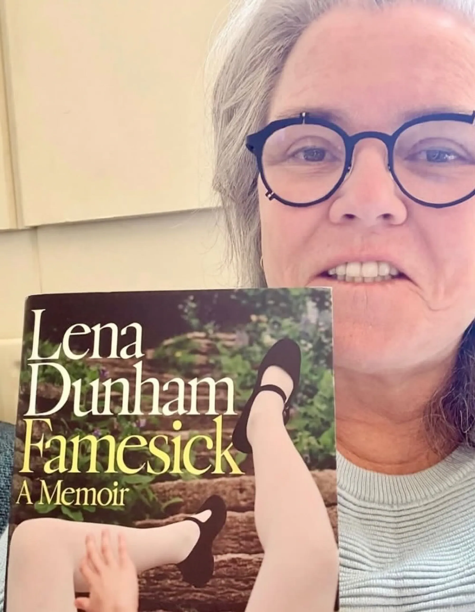 Rosie O'Donnell holding the book