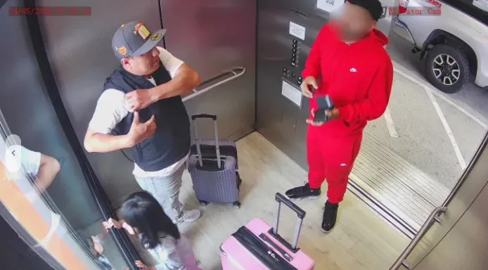 Ruben Fregoso with Daleyza Fregoso in an elevator with another man and two suitcases.